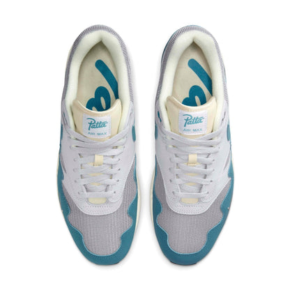 White Patta Air Max 1 sneakers with aqua panels and printed logo on tongue