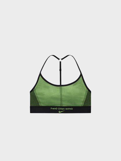 Green sports bra with black elastic trim and racerback straps, center back seam