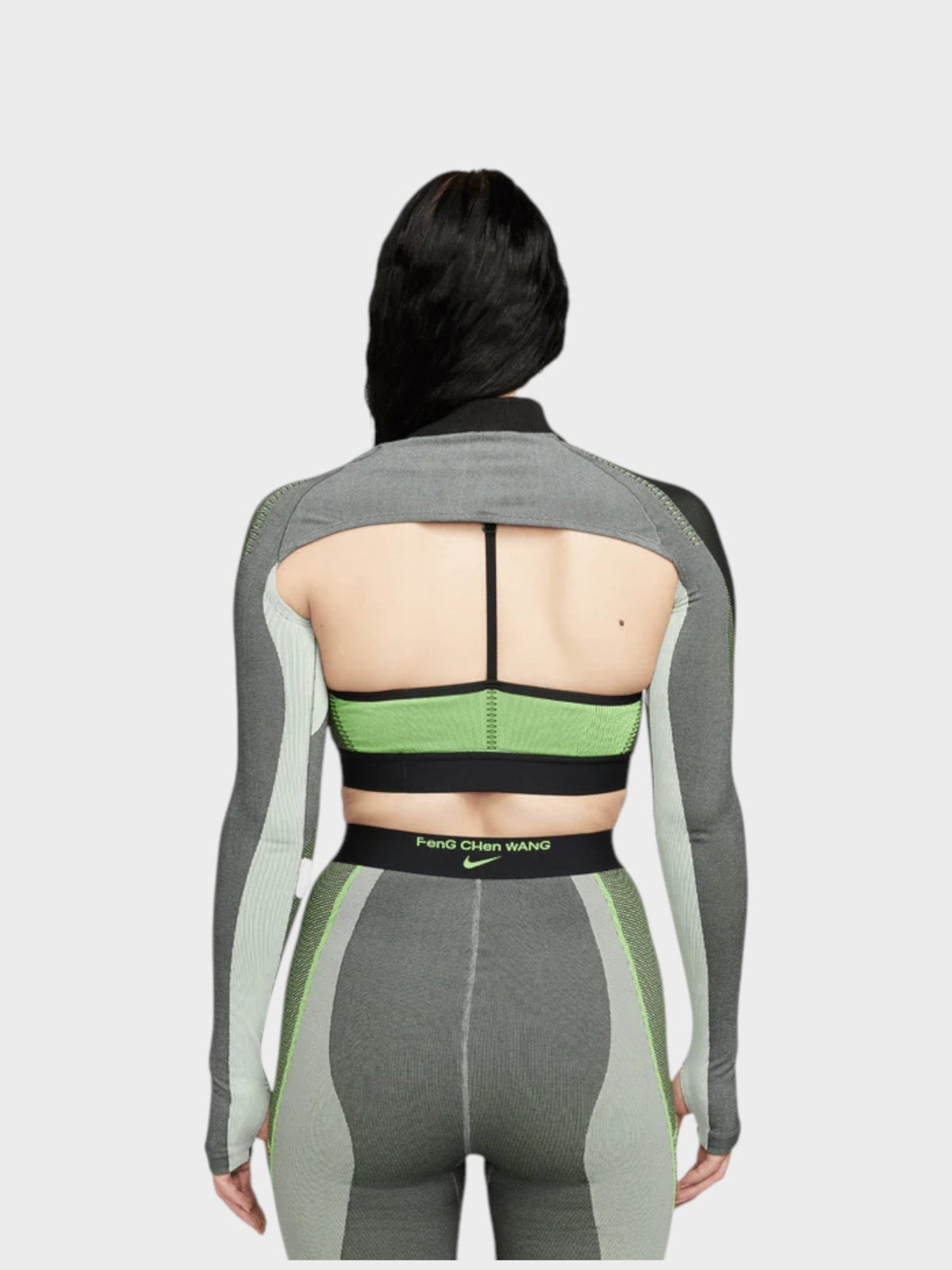 Long-sleeve knit top back view with racerback straps, green band, and gray cutout