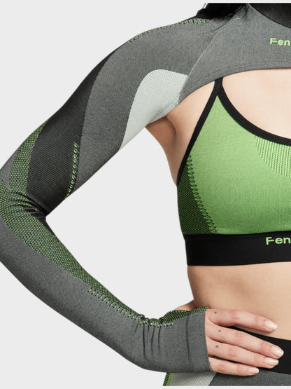 Long-sleeve knit top with ribbed cuffs, black trim, and gray/green paneling