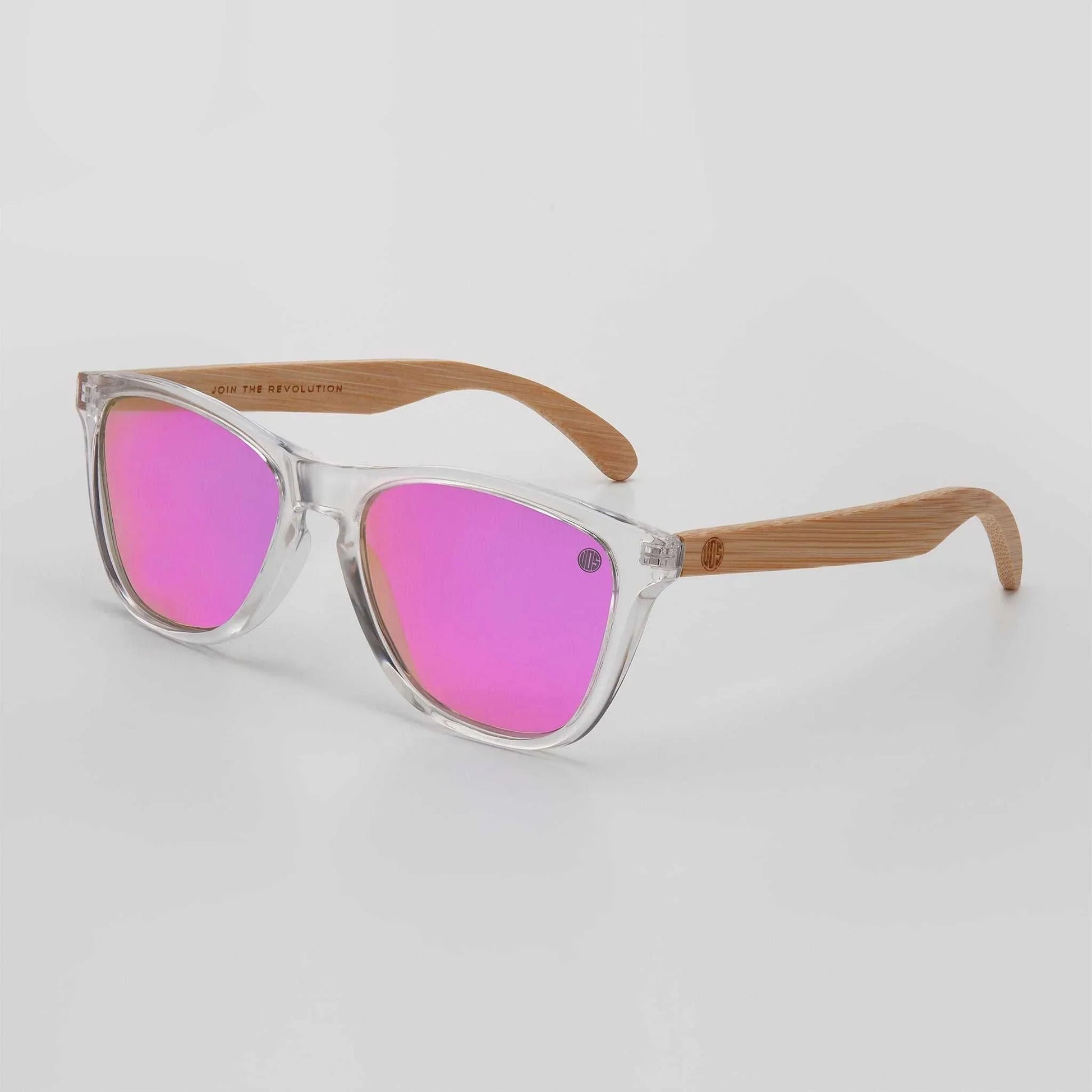 Pink mirrored polarised sunglasses with clear frame and light wood temples.
