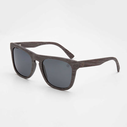 Black wood-look sunglasses with dark mirrored lenses and rectangular cat-eye frames