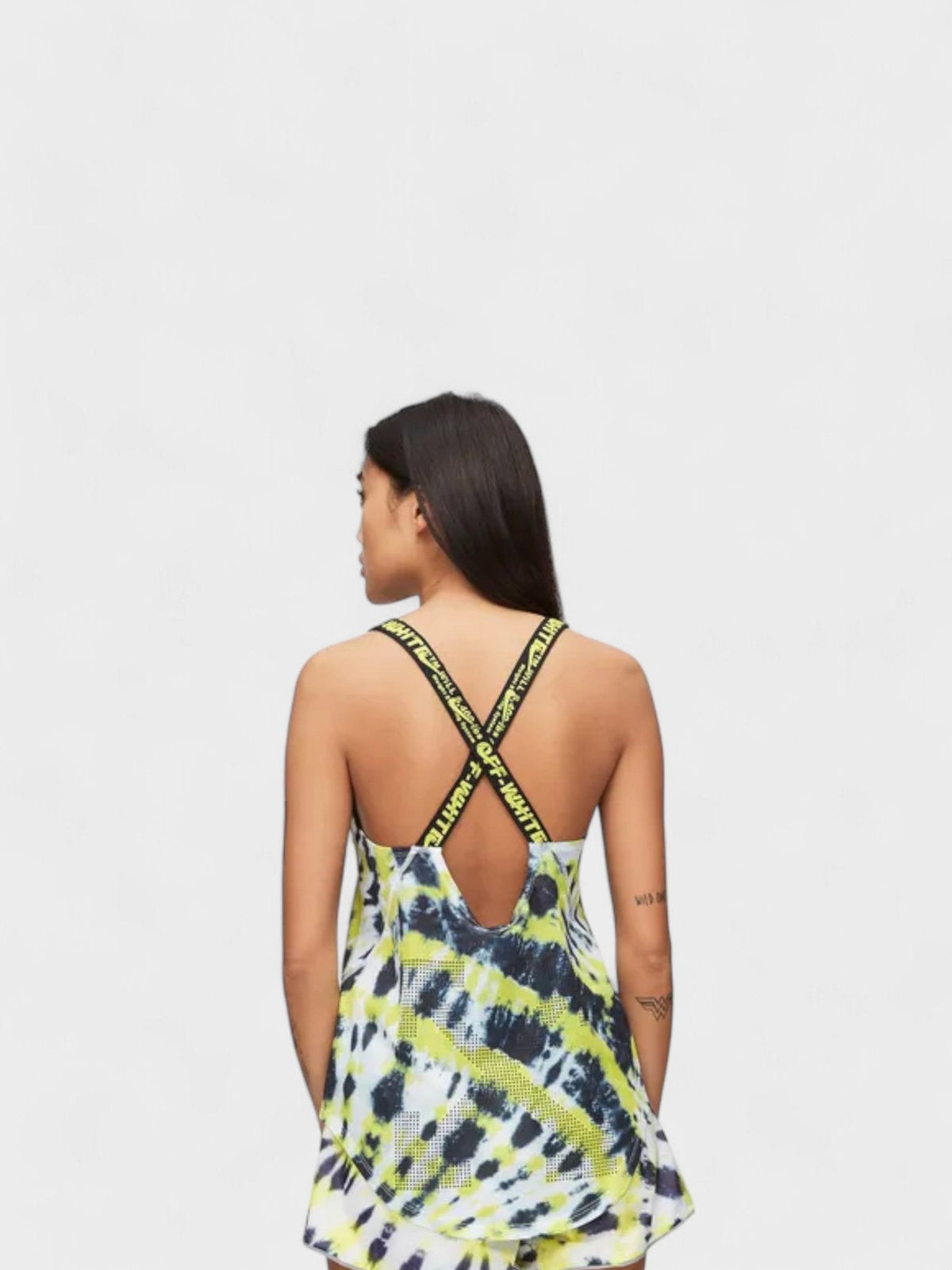 Women's Nike tank top back view with open back, crossed straps, and yellow/black tie-dye print