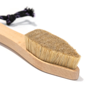 Boar-hair brush head with tan bristles set into light wood base