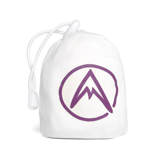 Refillable climbing chalk ball in white fabric pouch with purple logo and pull cord.
