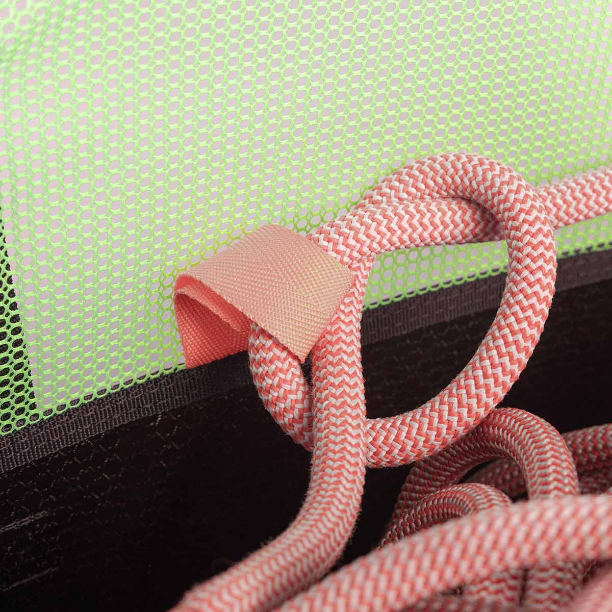 Orange-and-pink braided rope handle attachment on black mesh rope bag