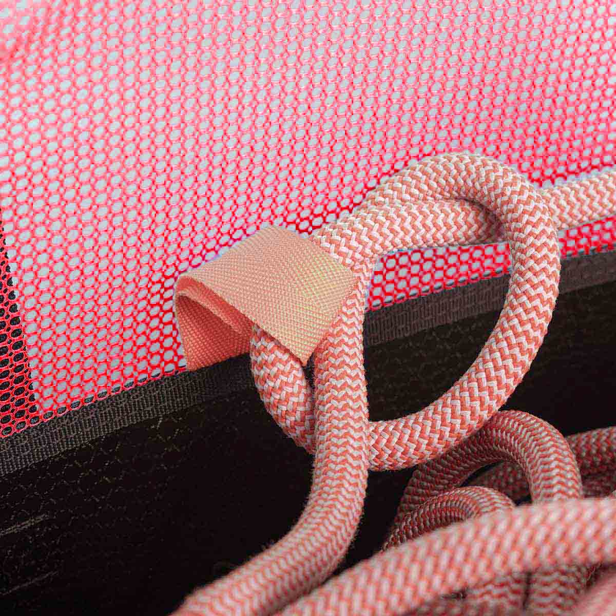 Orange climbing rope and mesh fabric on black rope bucket bag with webbing strap detail