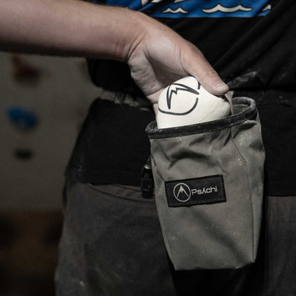 Psychi chalk ball pouch inside a climbing chalk bag