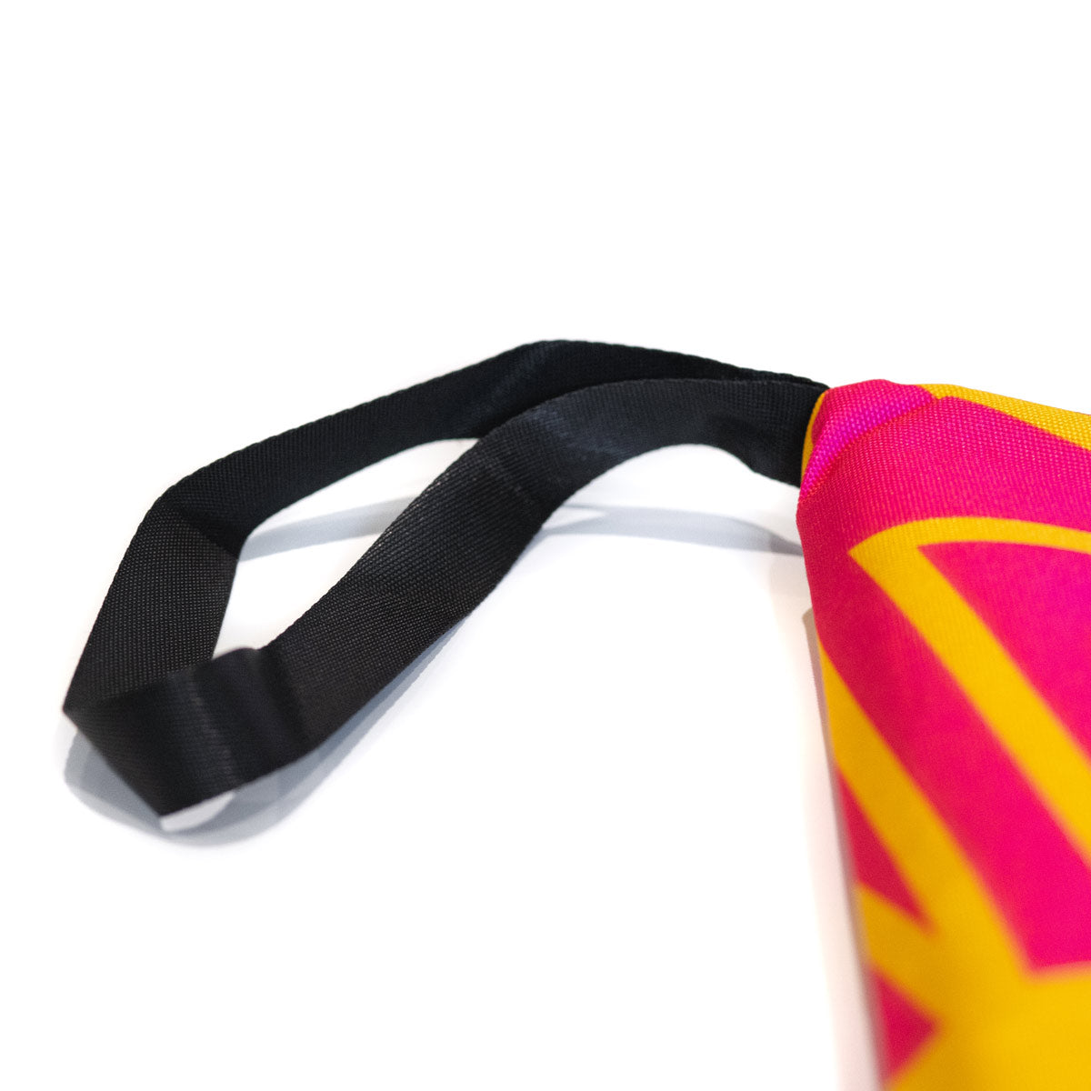 Climbing guidebook cover corner with pink/yellow zigzag, black strap and trim
