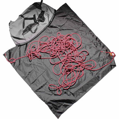 Grey climbing rope bag with black straps and red rope laid on top.