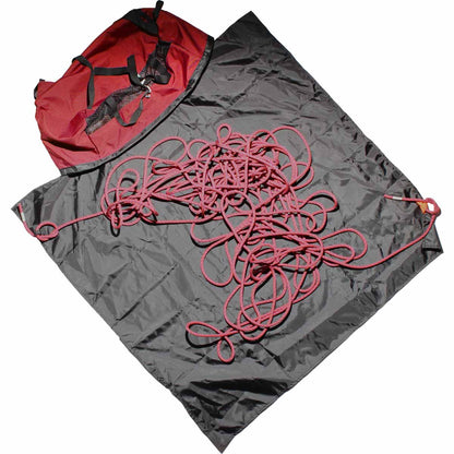 Grey and red climbing rope bag with loose coiled rope on top