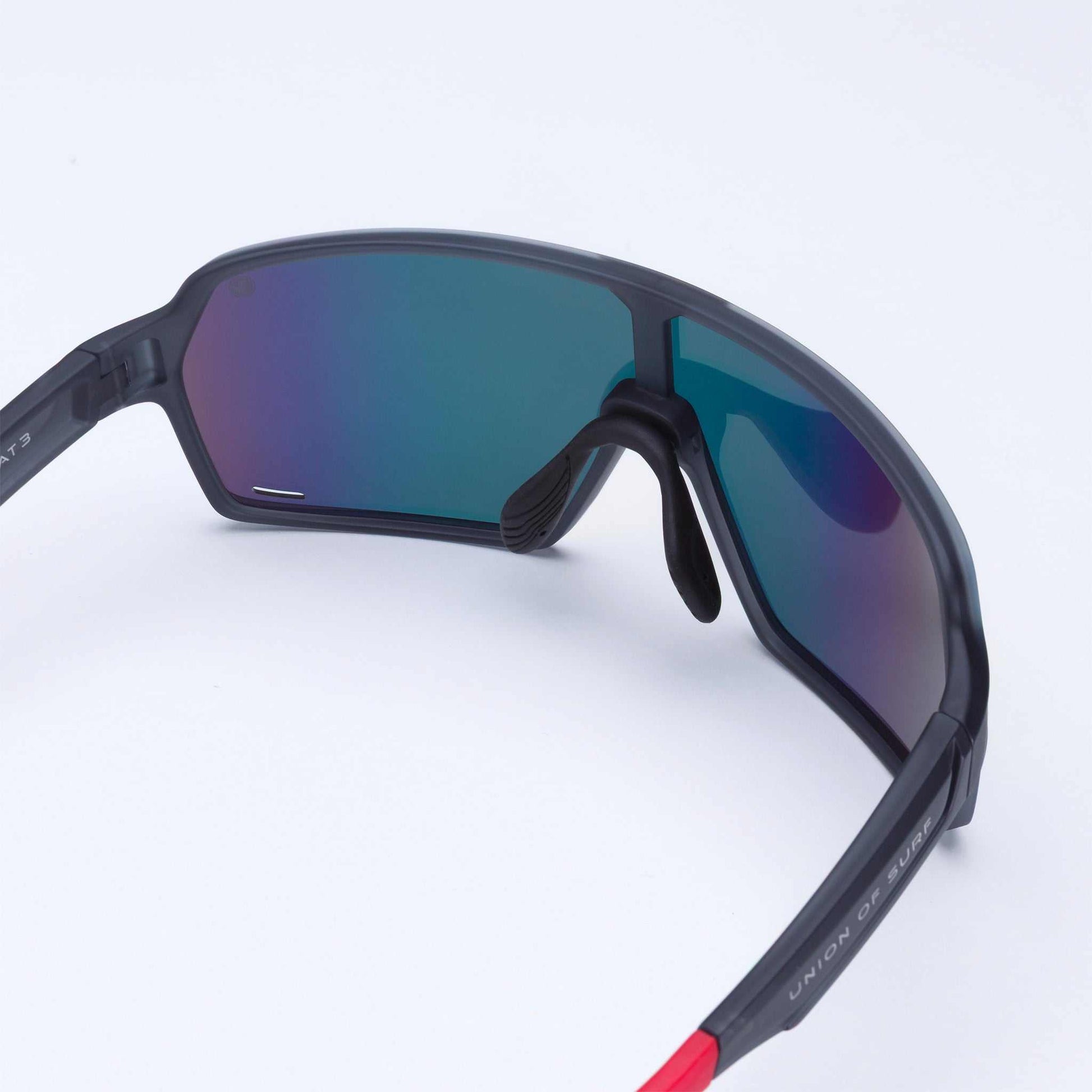 Close-up of wraparound sports sunglasses with dark lenses and black frame