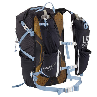 Black Ultimate Direction hydration backpack with blue straps on a white background