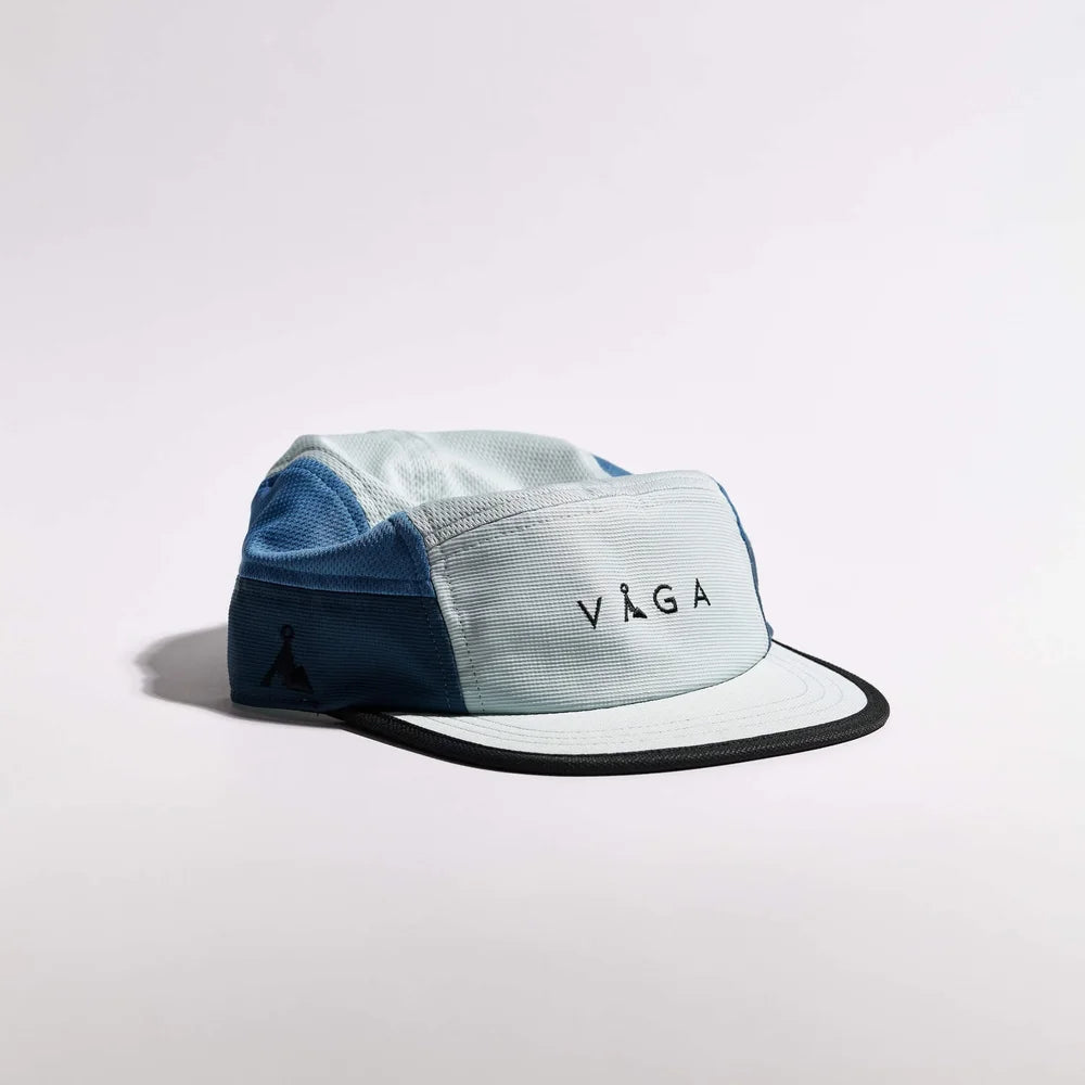 Two-tone cap with 'VAGA' logo on a light gray background