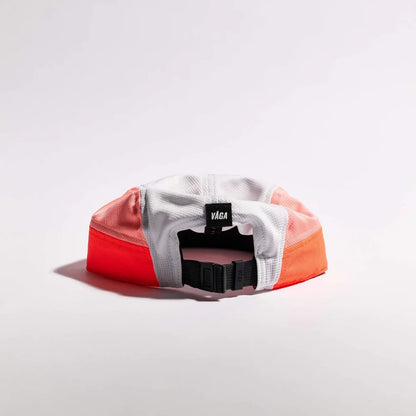Color-blocked cap with 'Vaga' brand logo on a light gray background