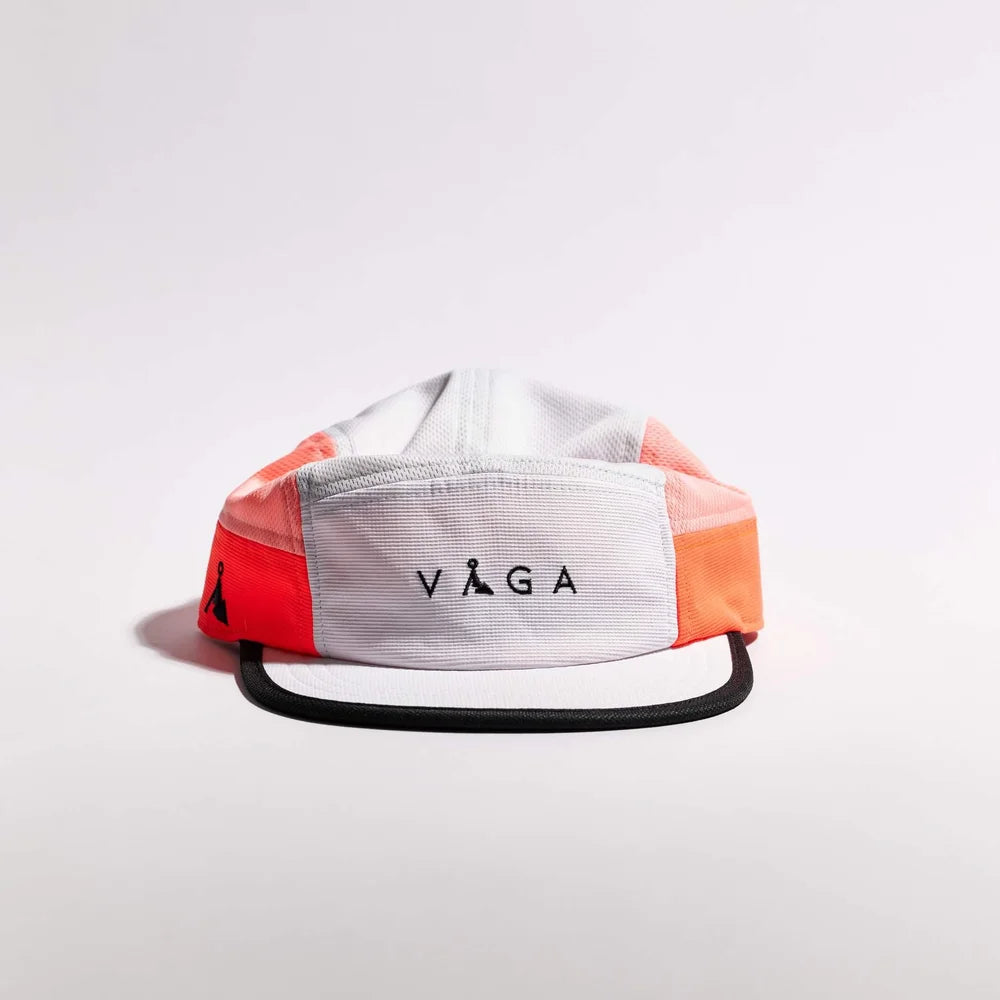 Colorful cap with 'VAGA' logo on a light gray background