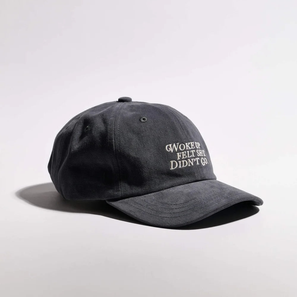 Dark gray cap with text on a light gray background