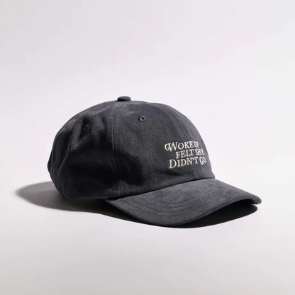 Dark gray cap with text on a light gray background