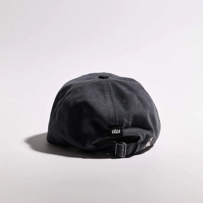 Black cap with 'Vaga' logo on a light gray background