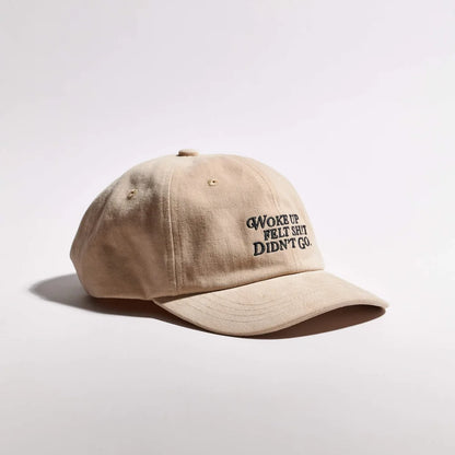 Beige cap with text on a light gray background