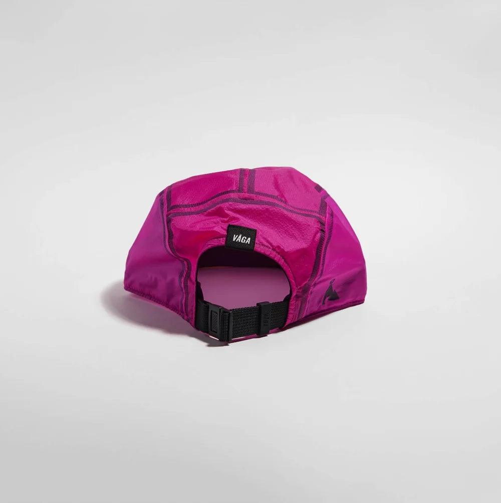 A bright magenta pink athletic cap with a black adjustable strap and a small black brand tag reading 'Vixt', shown on a light gray studio background.