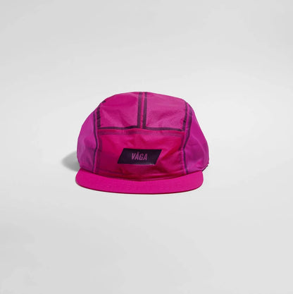 A bright pink VAGA brand 5-panel camp cap with dark purple piping and a matching pink visor, shown on a light gray background.