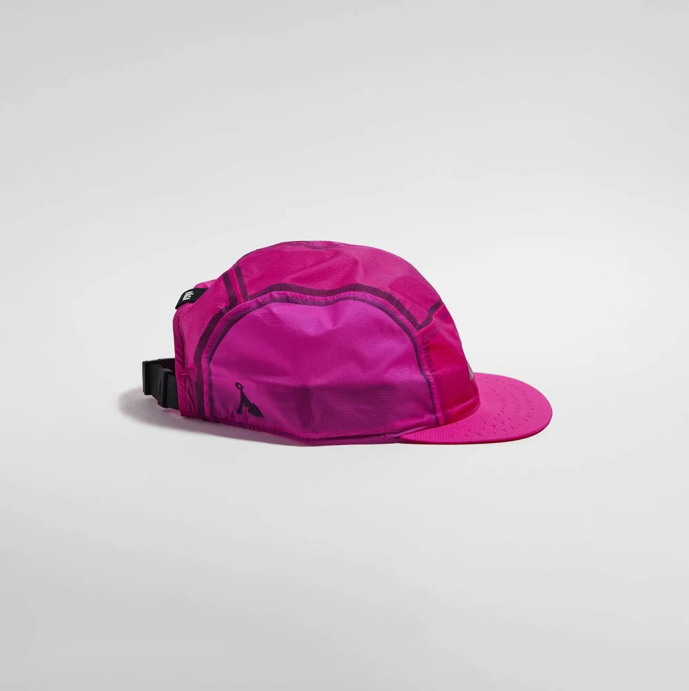 A bright pink cap with a structured crown, matching pink flat brim, and a black adjustable strap closure, shown on a light gray background.