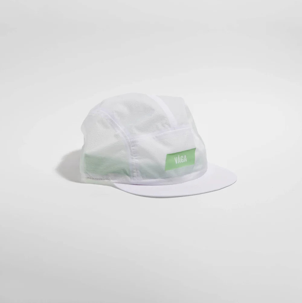 Clear plastic cap with a green label on a light gray background