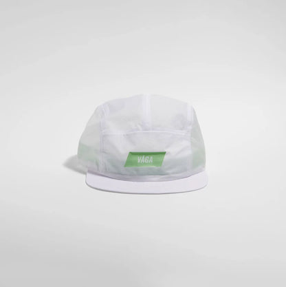 A white 5-panel camp cap with a green rectangular patch on the front displaying the white 'VAGA' brand name, set against a light gray studio background.