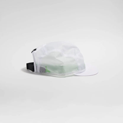 A white mesh running cap with a curved brim, featuring a black adjustable strap and a small green logo on the side, set against a seamless light gray studio background.
