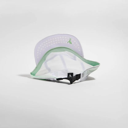 White and green cap with a logo on a light gray background