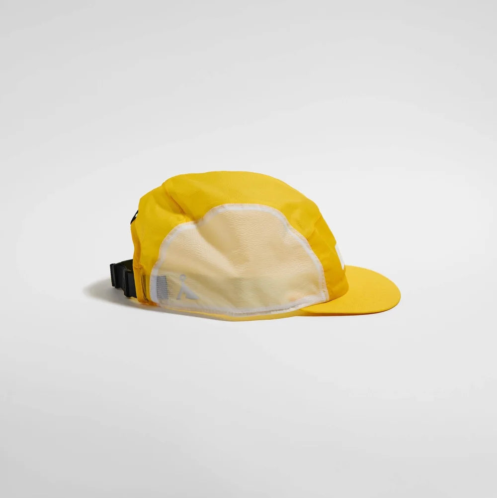 Yellow cap with a white interior on a light gray background