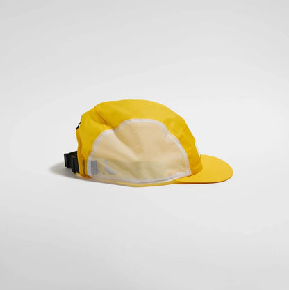 Yellow cap with a white interior on a light gray background
