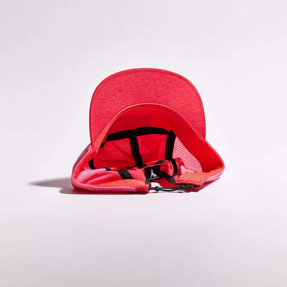 Red baby seat cover with black straps on a light gray background