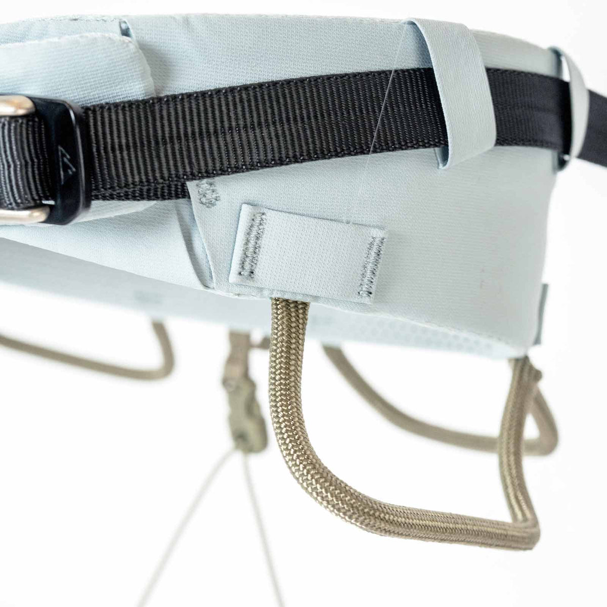 Light blue climbing harness belt with webbing loop and stitched adjustment area