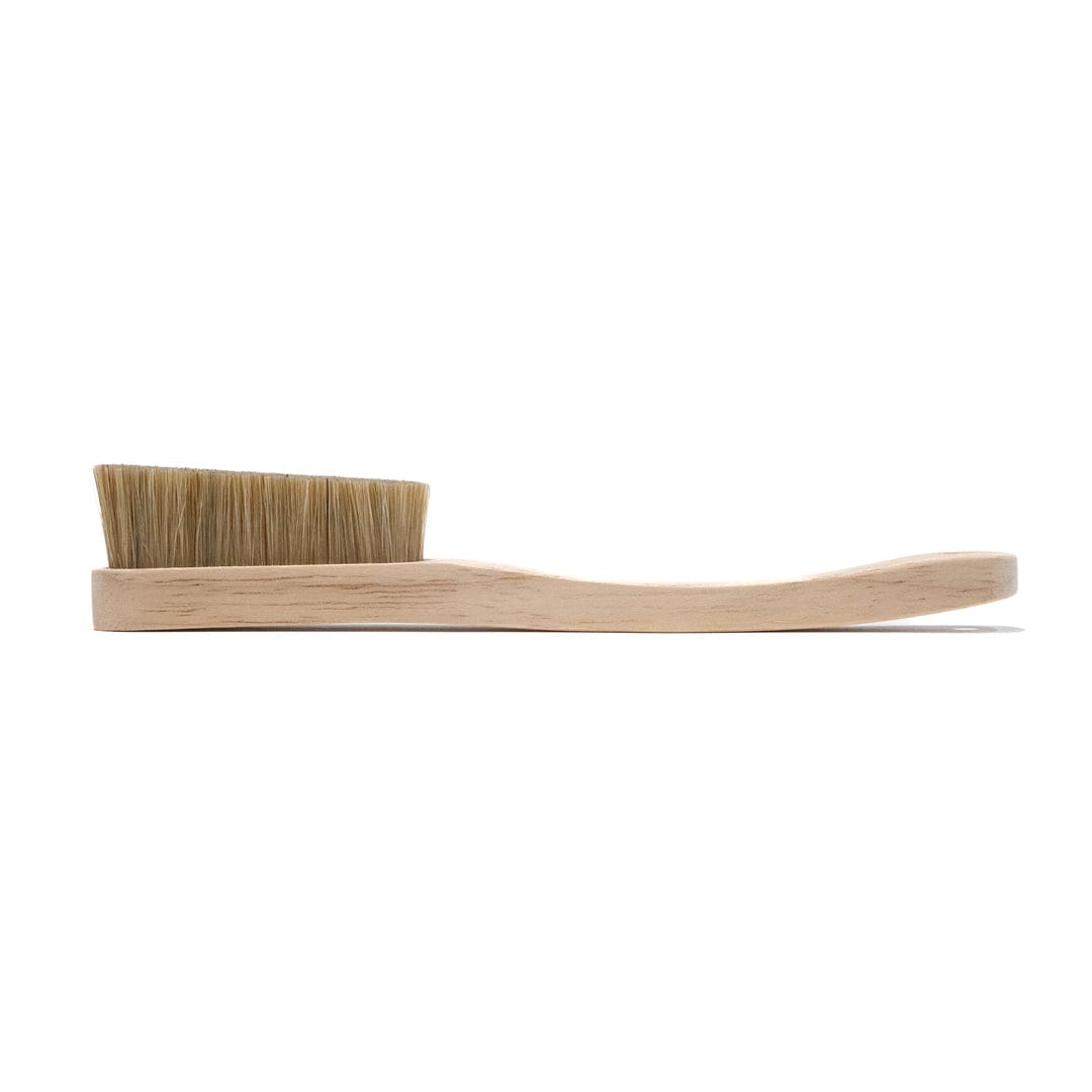 Boar hair climbing brush with angled wooden handle and natural bristle pad