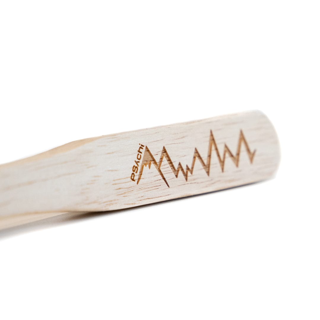 Boar hair climbing brush handle with etched zigzag logo and light wood grain